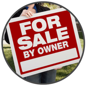 picture of a woman holding a for sale by owner sign